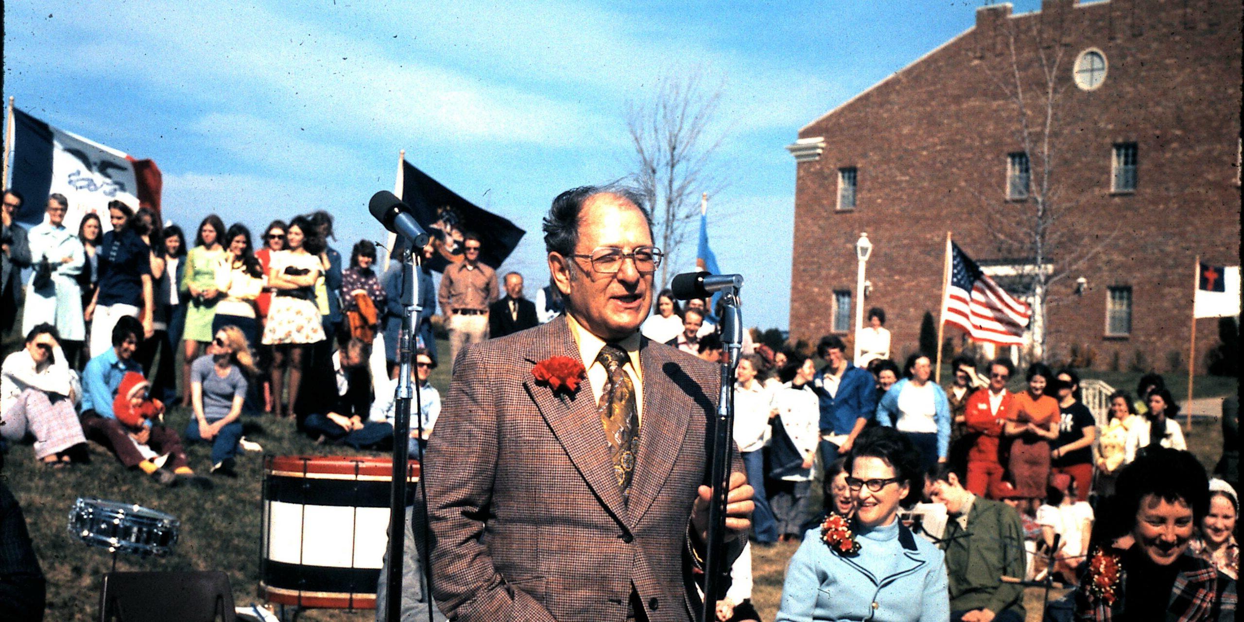 Dr Donald Metz in foreground at MNU initial accreditation celebration in 1974